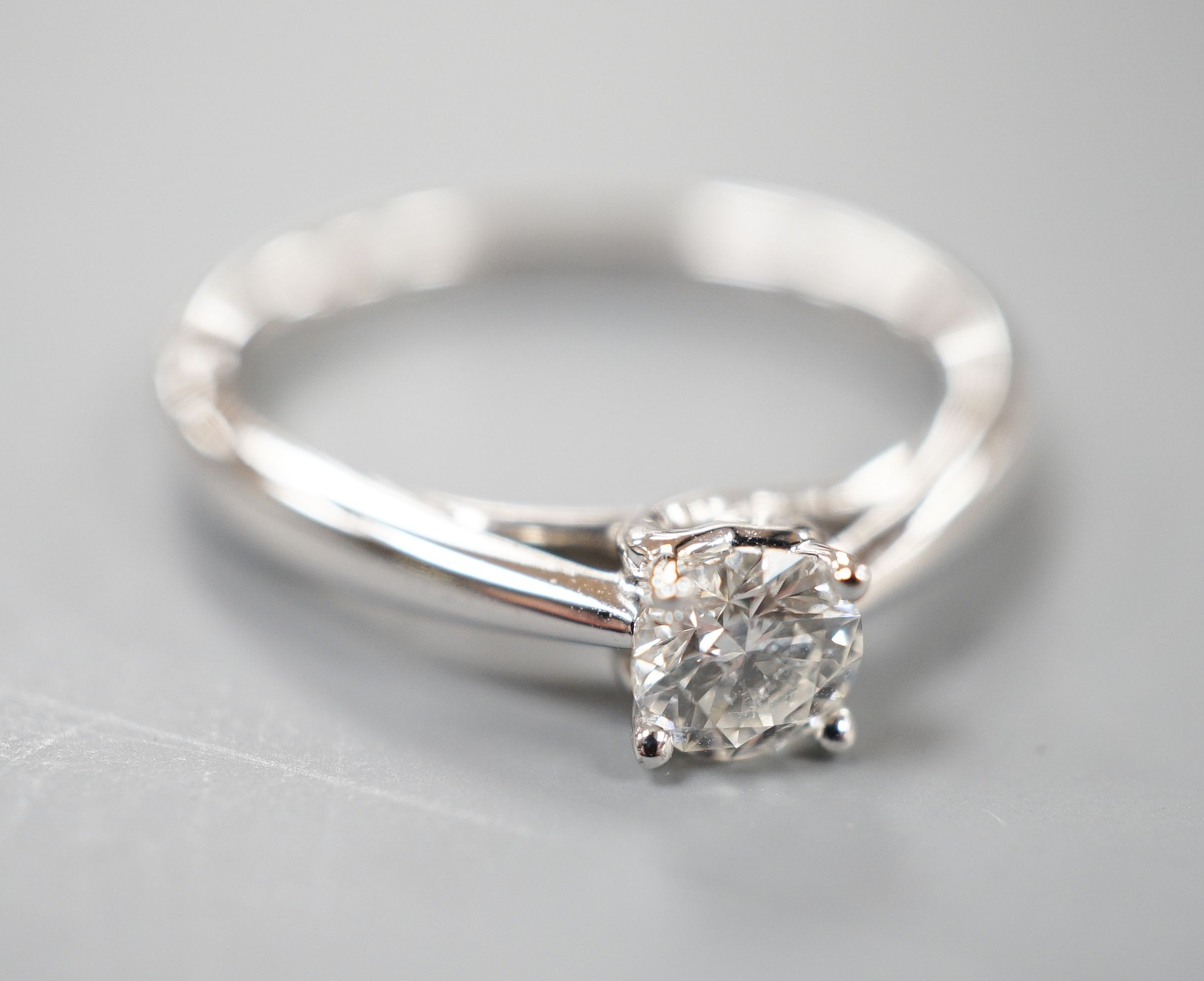 A modern 9k white metal and solitaire diamond ring, the stone weighing 0.33ct, size L, gross weight 2.5 grams.